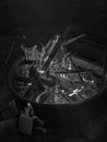 Lit Fire in Metal Pit In Wyoming WIth Zippo Lighter Flame Coming Out Sticks In Fire Grayscale Royalty Free Stock Photo