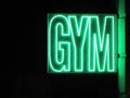 Lit gym sign glowing green