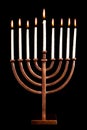 Lit hanukkah menorah black background. Royalty Free Stock Photo