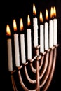 Lit hanukkah menorah black background. Royalty Free Stock Photo