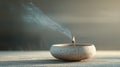 Lit incense stick in a ceramic holder with smoke trail Royalty Free Stock Photo