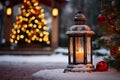 Lit lantern as a decoration of a front door on Christmas eve. Decorated and illuminated lantern on snowy New Years night. Snowy