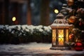 Lit lantern as a decoration of a front door on Christmas eve. Decorated and illuminated lantern on snowy New Years night. Snowy