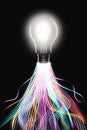 Lit light bulb with light trails leading to it innovation concept Royalty Free Stock Photo