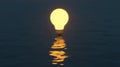 A lit lightbulb under water, with water droplets around it Royalty Free Stock Photo