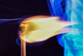 Lit matches and blown out in the studio photographed with colorful foils before the flashes