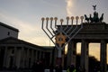 Lit menorah at empty Brandenburg Gate Hannukah during coronavirus pandemic in Mitte Berlin Germany