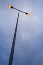 Lit modern streetlamp at evening or early night