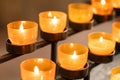 Lit prayer church candles with warm light Royalty Free Stock Photo