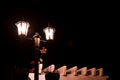 Lit street lamp against a dark sky Royalty Free Stock Photo