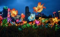 Lit up flowers at night view with cityscape background chinese new year festivities street