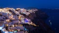 Lit-up by the lights of the hotels and resorts, the village Oia on the island of Santorini comes to life Royalty Free Stock Photo