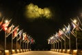 Lit up Mount Rushmore above flags Royalty Free Stock Photo