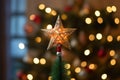a lit up star topper on a christmas tree Royalty Free Stock Photo