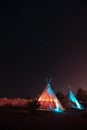 Lit up teepees at night under a sky of stars in Marfa, Texas Royalty Free Stock Photo