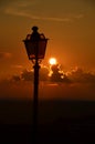 Lit Vertical Lightposts with Sunrise Background