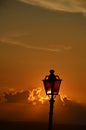 Lit Vertical Lightposts with Sunrise Background