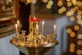 Lit wax candles in a Christian church, decoration in the Orthodox Church, symbol of faith and prayer Royalty Free Stock Photo