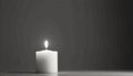 Lit White Candle on Gray Surface Royalty Free Stock Photo