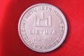10 Litai historic Lithuania silver coin isolated on the red background