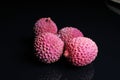 Litchi chinensis lychee sweet fruit on black background