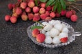 Litchi fruits. Fresh juicy lychee fruit on a glass plate. Peeled lychee fruit.