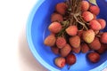 Litchi, lichee, lychee, or ripe litchi isolated on bright colorful background in a bowl with copy space