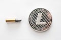 Litecoin coin with a bullet