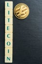 Litecoin gold coin with text made out of letter tiles