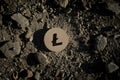 Litecoin Symbol on Construction Dirt