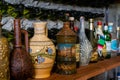 A collection of different alcoholic beverages bottles on the shelf in the cellar Royalty Free Stock Photo