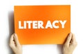 Literacy is the ability to read, write, speak and listen, text concept on card for presentations and reports