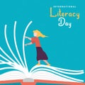Literacy Day card girl turning open book pages Royalty Free Stock Photo
