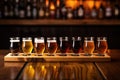 literal beer flight with pours of different beers on a wooden tray