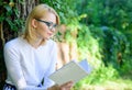 Literature as hobby. Girl keen on book keep reading. Bestseller top list concept. Woman blonde take break relaxing in
