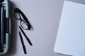 Literature, author and writer, writing and journalism concept: vintage typewriter and glasses and a blank sheet of paper Royalty Free Stock Photo