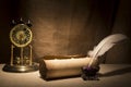 Literature concept. Old inkstand with feather near scroll and vintage clock on canvas background Royalty Free Stock Photo