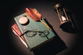 Literature concept. Vintage still life with hourglass near glasses on old books near feather or quill and clock Royalty Free Stock Photo