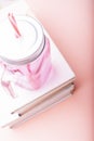 Literature concept. White books with a pink cup on a pink background Royalty Free Stock Photo