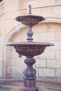 Lithic fountain with dripping water