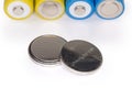 Lithium button batteries against batteries other type close-up Royalty Free Stock Photo