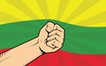 Lithuania fight protest symbol with strong hand and flag as background