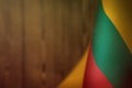 Lithuania flag for honour of veterans day or memorial day. Glory to the Lithuania heroes of war concept on orange blurred natural