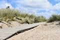 Lithuania landscape.Wooden pathway through sand dunes. Royalty Free Stock Photo