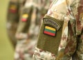 Lithuania patch flag on soldiers arm. Lithuanian military uniform. Lithuania troops Royalty Free Stock Photo