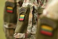 Lithuania patch flag on soldiers arm. Lithuanian military uniform. Lithuania troops Royalty Free Stock Photo