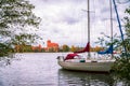Lithuania, Trakai 2017. 10. 19 white boat on Galve lake and Trakai castle on the background. Trakai castle is gothic style and now