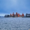 Lithuania Travel Ideas. Trakai Medieval Castle with Towers of Red Bricks in Lithuania over Galve Lake