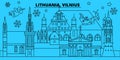 Lithuania, Vilnius winter holidays skyline. Merry Christmas, Happy New Year decorated banner with Santa Claus.Lithuania
