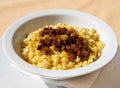 Lithuanian Cuisine - Fried Rice with Meat, typical snack with the beer in Lithuania. Plate with peas closeup